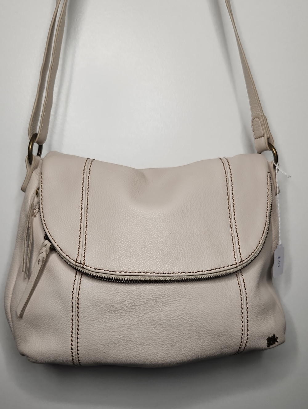 The Sak Cream leather foldover xbody, bronze hardware. Preloved item sold as is